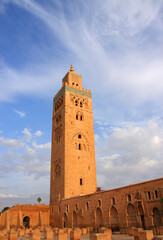 Fototapeta premium Morocco Marrakesh Koutoubia Mosque and Minaret in the late afternoon sunlight with dramatic sky. UNESCO World Heritage