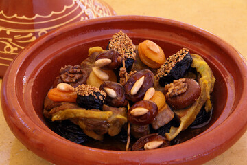 Morocco, Tajine of lamb with dried fruits - apricots, figs, prunes, almonds, apricots, walnuts and sesame seeds. Traditional Moroccan gastronomic delicacy.