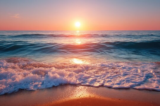 Sunrise over a tranquil beach.  Waves crash gently on golden sand