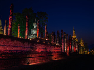 Wat Mahathat illuminated by colorful light at night for Loy Krathong festival celebration