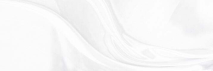 White gray satin texture that is white silver fabric silk panorama background with beautiful soft blur pattern natural.
