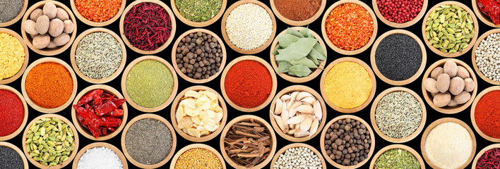 Set of different aromatic spices in bowls on black background, flat lay. Banner design