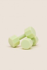 Light green dumbbells fitness equipment for exercise and strength training use