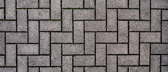 A brick wall with a pattern of squares and triangles