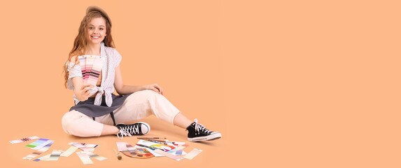 Female interior designer with color palettes on beige background with space for text