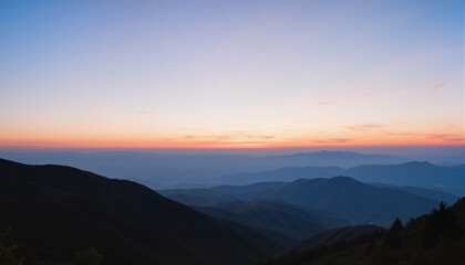 Obraz premium Mountain landscape at sunset with layers of hills