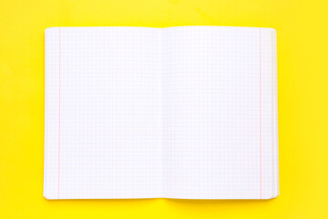 Blank copybook pages on yellow background