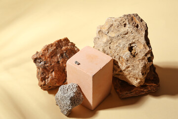 Decorative stone podiums on color background