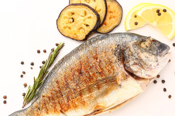 Tasty grilled dorado fish with eggplant on white background