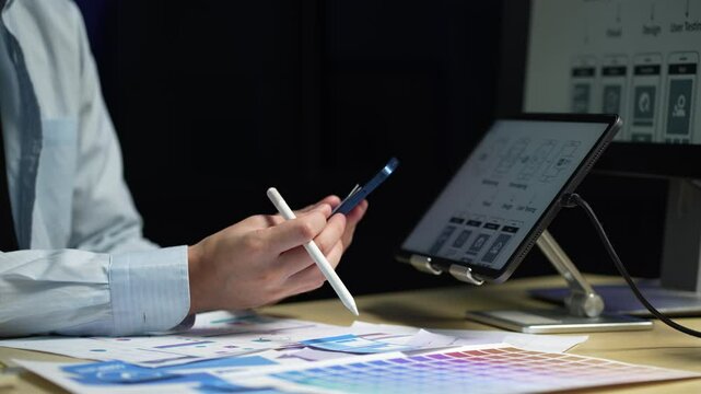 Male coder or developer working overtime using a computer display in problem solving at workplace.
