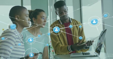 Man pointing at laptop starting tech net overlay fading as team following nodes for presentation - Powered by Adobe