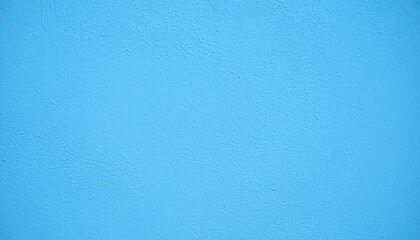 Light blue painted wall featuring a textured surface creates a calming and minimalist backdrop.