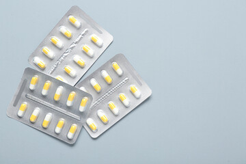 Blister packs with pills on white background