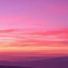 Vibrant sunset sky with pink and purple hues over a tranquil landscape