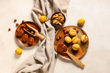 Tasty walnut shaped cookies with boiled condensed milk and hazelnuts on white grunge table