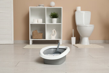 Grey litter box for cat in bathroom © Pixel-Shot