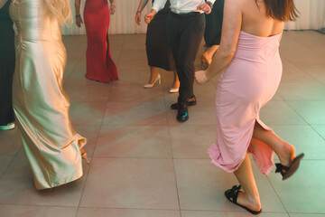 beautiful women's long legs while dancing, pretty and shapely women's figure, dancing people at a...