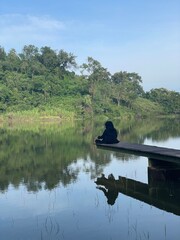 The beautiful Claket Lake reflects hills and clouds like a mirror. Its calm, clear water creates a stunning scene, blending sky and nature in perfect harmony.