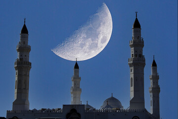 A mosque with four minarets at sunset. The Quba Mosque is a mosque located in Medina, Saudi Arabia.