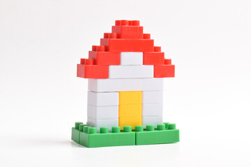 Lego house isolated on white background. Plastic building blocks
