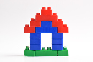 Lego house isolated on white background. Plastic building blocks © Mulad Images