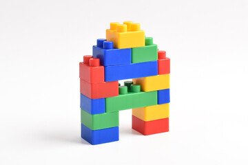 Fototapeta premium Plastic building blocks isolated on white background