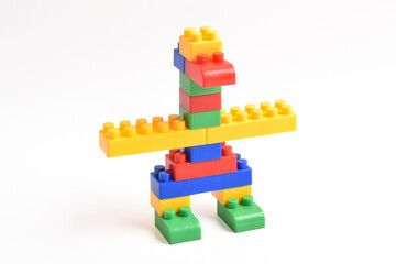 Plastic building blocks isolated on white background. Bird shape
