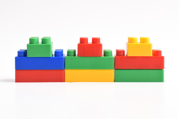 Naklejka premium Plastic building blocks isolated on white background