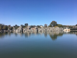 Fototapeta premium The Stone Forest or Shilin Yi Autonomous County, Yunnan and unique, can see the lake 