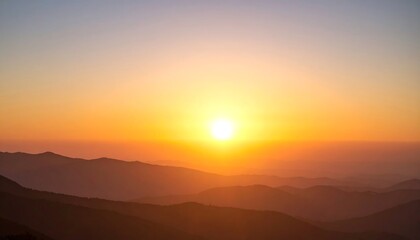 Obraz premium Sunrise over hazy mountains