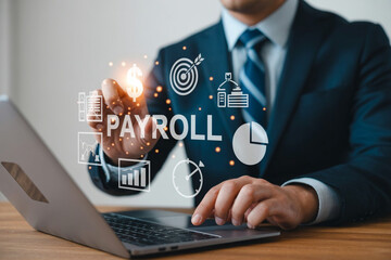 Businessman Using Digital Payroll Management System on Laptop for Financial Planning