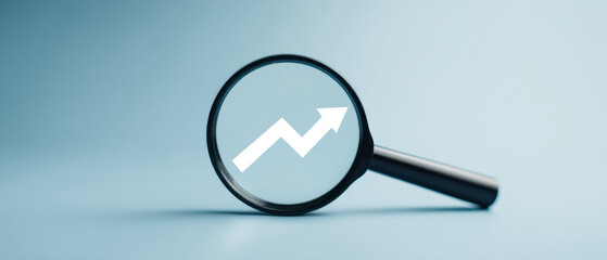 Business Growth Analysis with Magnifying Glass and Upward Trend