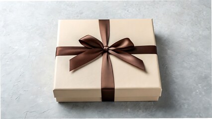 Elegant gift box with brown ribbon bow on grey background