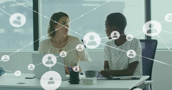 Businesswomen at desk scrolling laptop and taking notes, growing user nodes and ending high-fiving