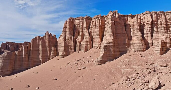 Aerial view of the yardang landform mountain and rock formations in desert. Famous Dahaidao no man's land natural landscape in Xinjiang, China.