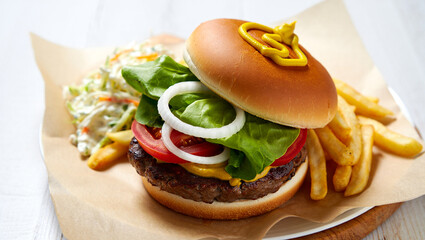 Juicy Beef Burger with Lettuce Tomato Onion Rings Yellow Mustard French Fries and Coleslaw on Brown Paper