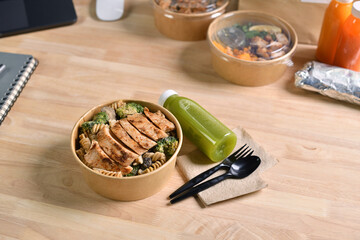 Having a lunch break at the office with delicious Healthy food delivery in take away boxes, Healthy eating concept.