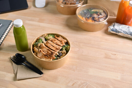 Having a lunch break at the office with delicious Healthy food delivery in take away boxes, Healthy eating concept.