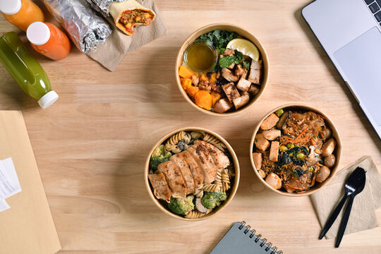 Having a lunch break at the office with delicious Healthy food delivery in take away boxes, Healthy eating concept. - Powered by Adobe