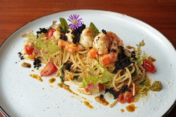 Shrimp Pesto Pasta. Spaghetti with shrimp in pesto sauce. Italian food