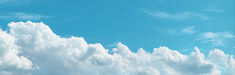 Beautiful clear sky with fluffy cumulus clouds, offering a peaceful and uplifting view ideal for photography prints, website headers, or calming home decor visuals.