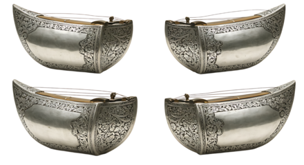 Four ornate silver musical instruments