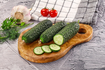 Raw green cucumbers with slices