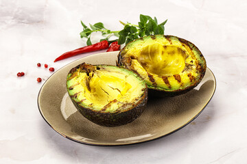 Sliced fresh avocado on the grill