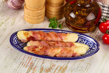 Hot mozzarella sticks with bacon