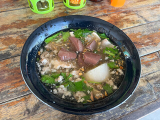 thai spicy pork with rice soup