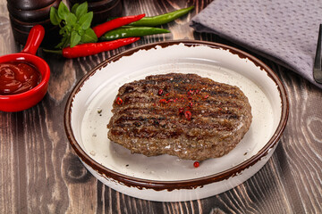 Grilled beef burger cutlet with sauce