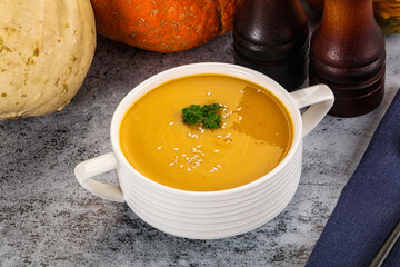 Vegan pumpkin cream soup served sesam