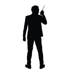 Silhouette of a Professional Holding a Walkie-Talkie in Action
