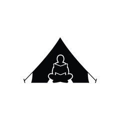 Person reading book inside camping tent silhouette